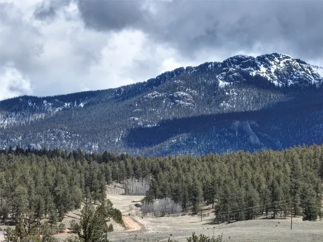 a view of a dry yard covered with snow