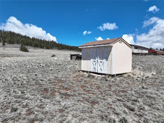 a view of a backyard of the house
