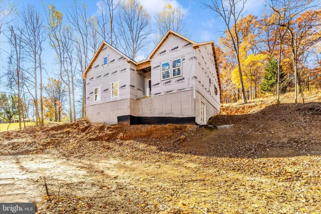 a view of a house with snow on the road