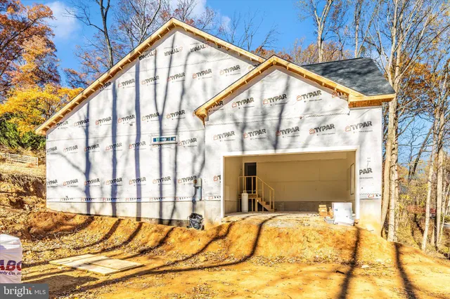 a view of swimming pool with a house