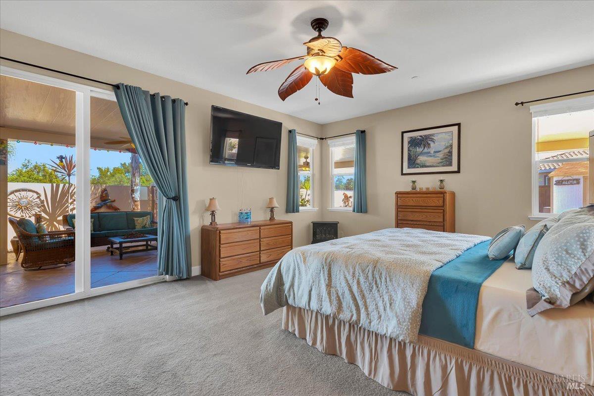 331 Frisbie Circle Vacaville, CA 95688 - Photo 34 of 93 Large Primary Bedroom with sliding door leading to incredible backyard! The hot tub is located close by for easy access in and out of your bedroom.