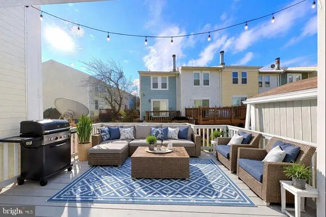 a living room with furniture and a rug