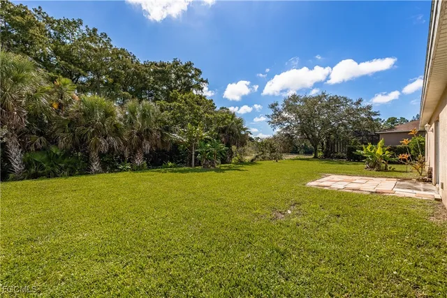 a view of a field of grass and building