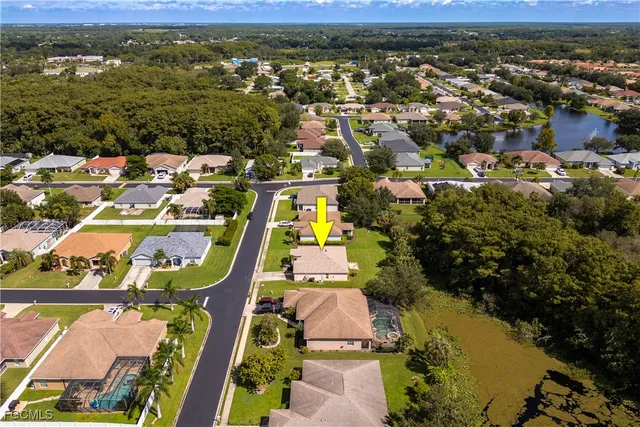 an aerial view of houses and swimming pool