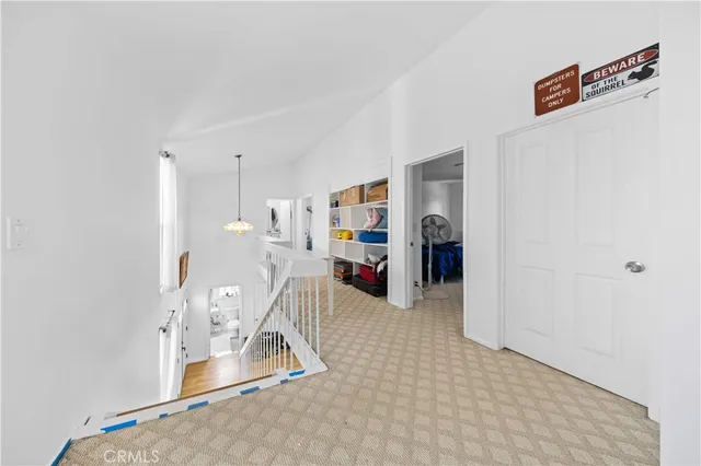 a room with furniture and white walls