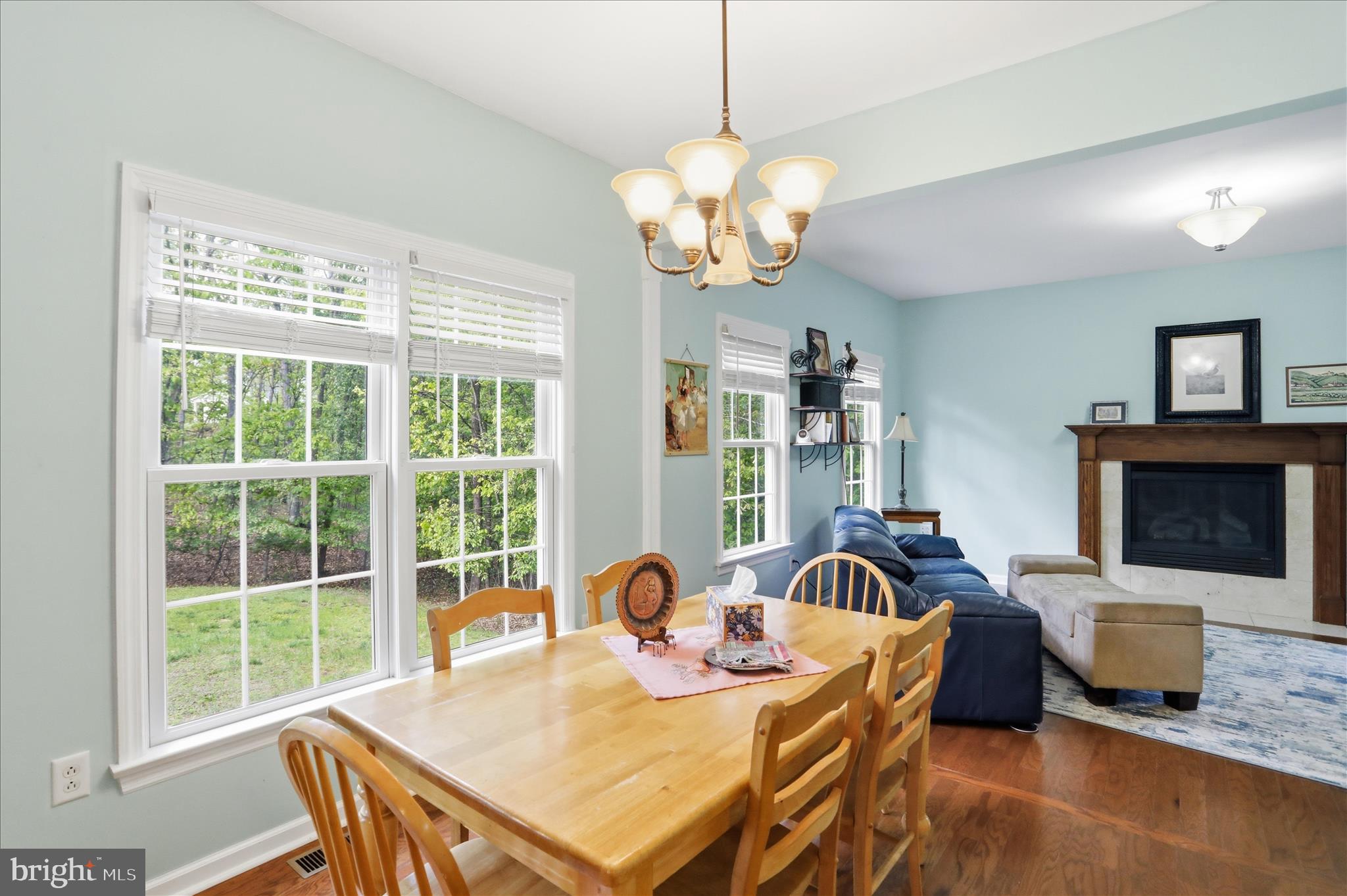 1175 North Lakewood Drive Ridgeley, WV 26753 - Photo 12 of 33 a view of a dining room with furniture a chandelier and large windows