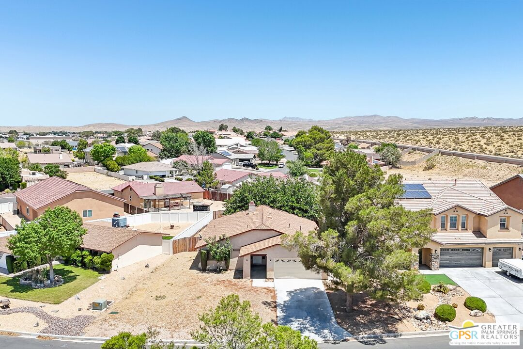 13819 Rivers Edge Road Helendale, CA 92342 - Photo 4 of 31 an aerial view of residential houses with outdoor space