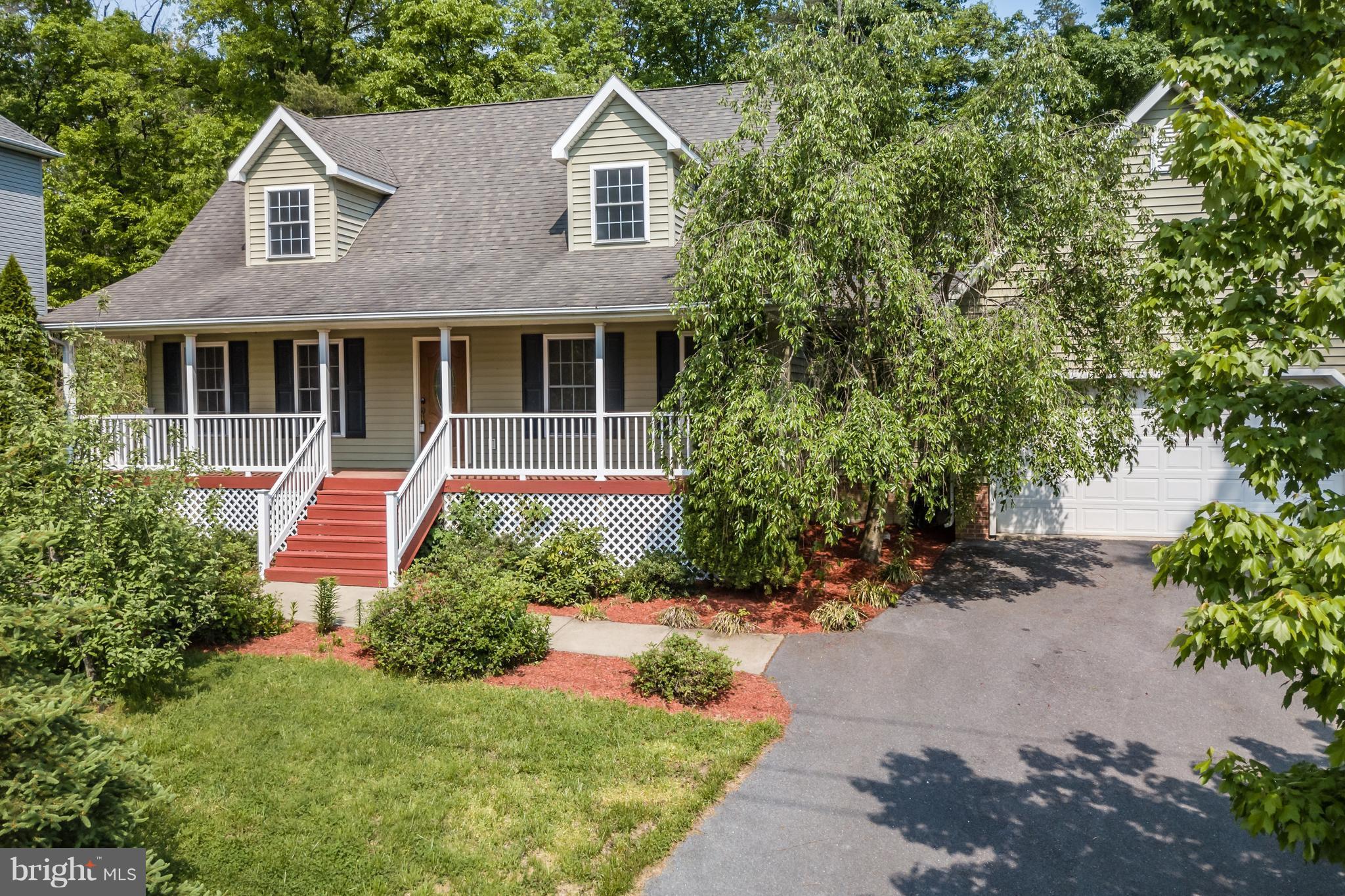 141 Holiday Road Cross Junction, VA 22625 - Photo 1 of 30 a front view of a house with a yard and potted plants