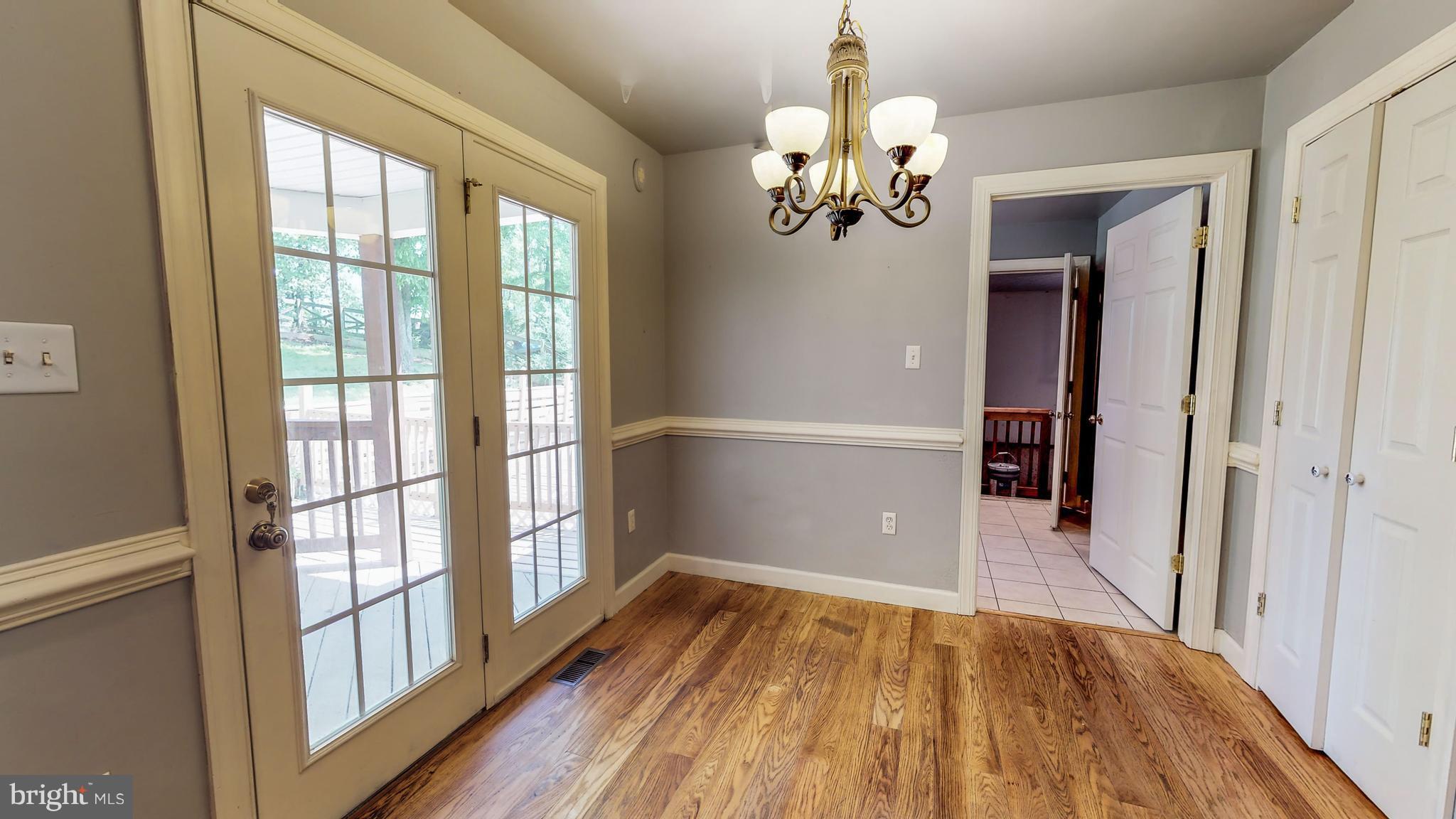141 Holiday Road Cross Junction, VA 22625 - Photo 14 of 30 wooden floor in an empty room with a window