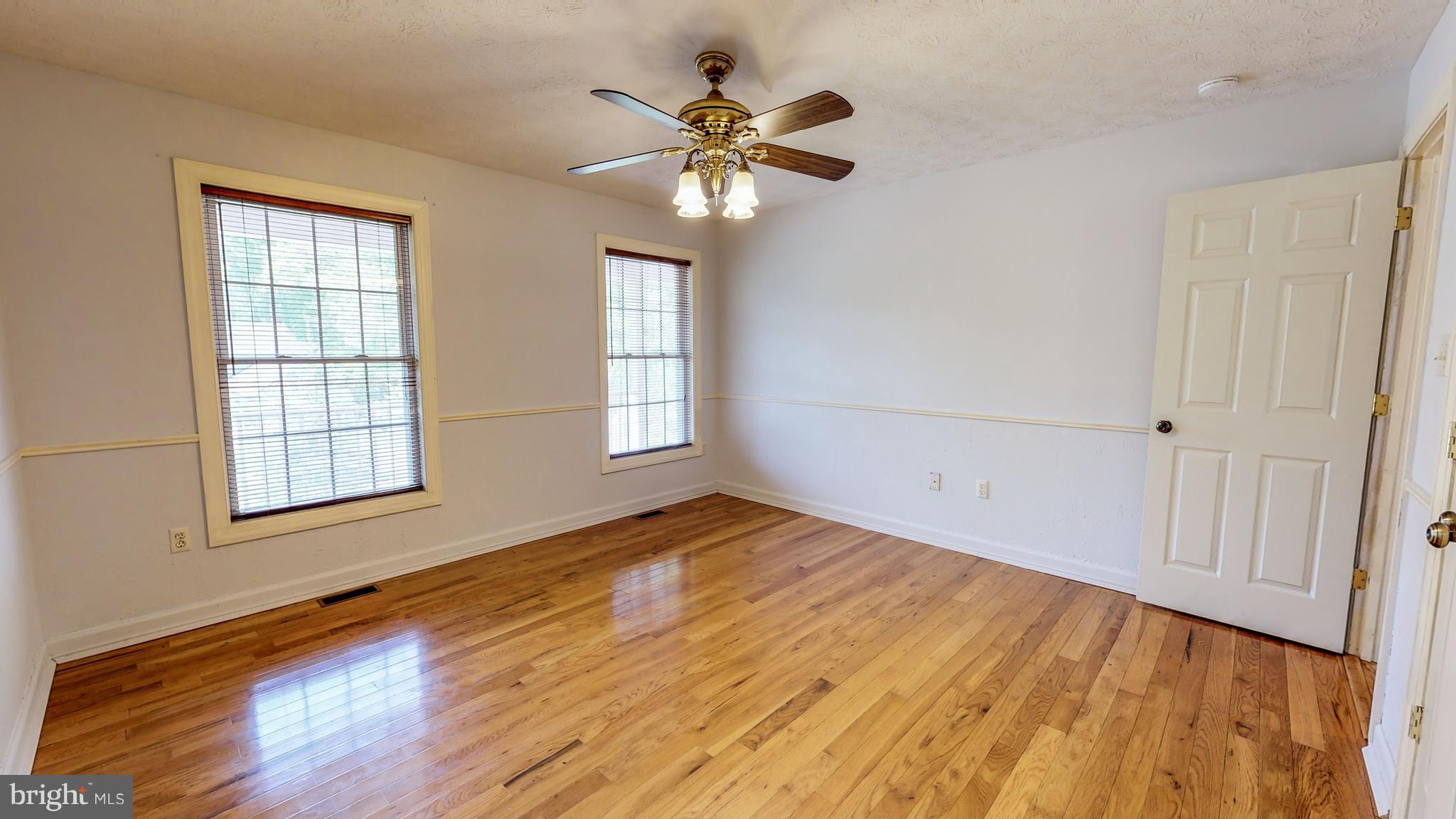 141 Holiday Road Cross Junction, VA 22625 - Photo 16 of 30 wooden floor in an empty room with a window