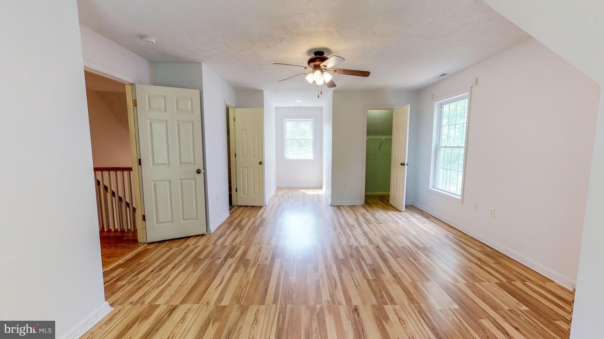 141 Holiday Road Cross Junction, VA 22625 - Photo 18 of 30 wooden floor in an empty room with a window