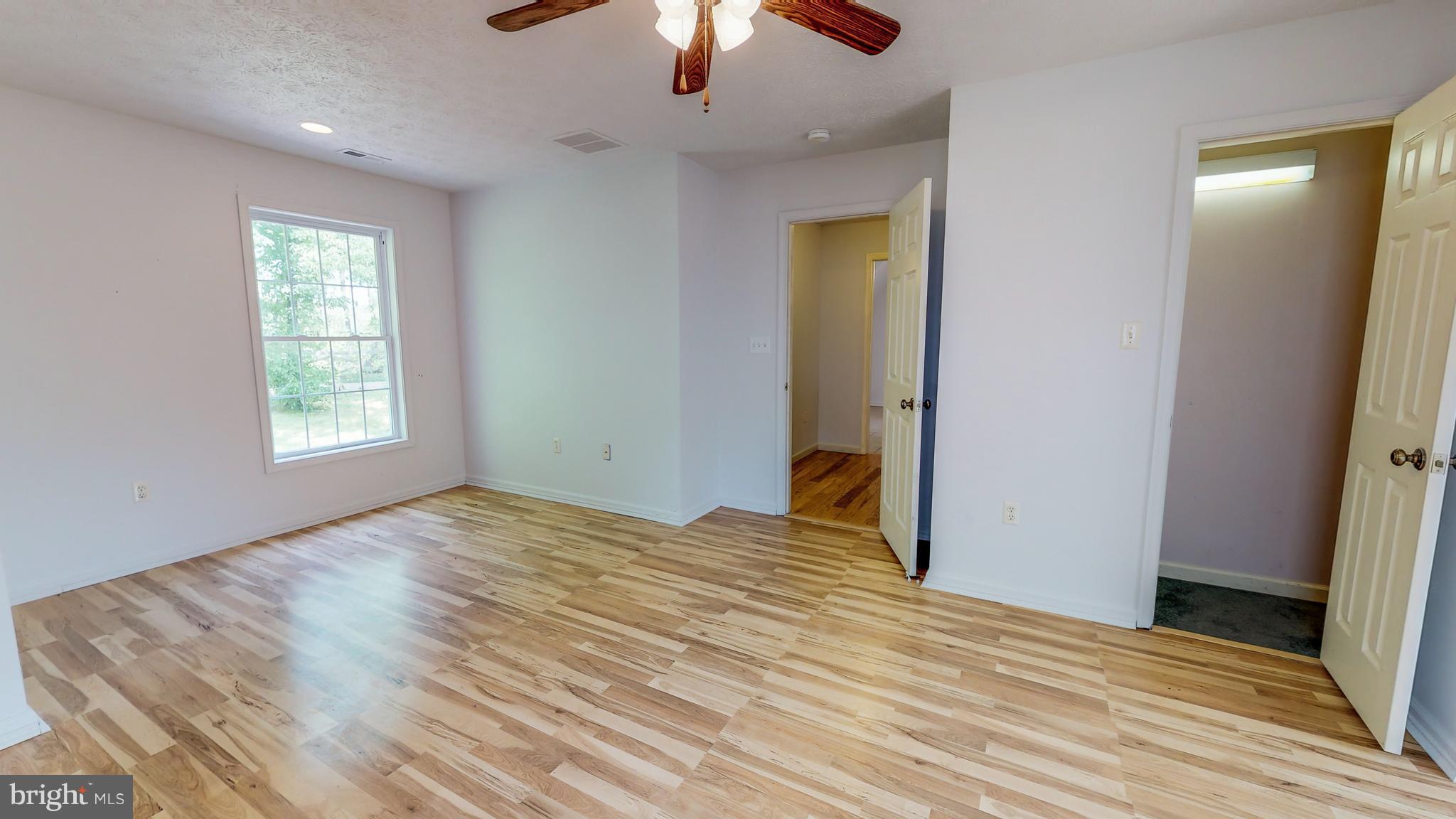141 Holiday Road Cross Junction, VA 22625 - Photo 19 of 30 a view of empty room with wooden floor
