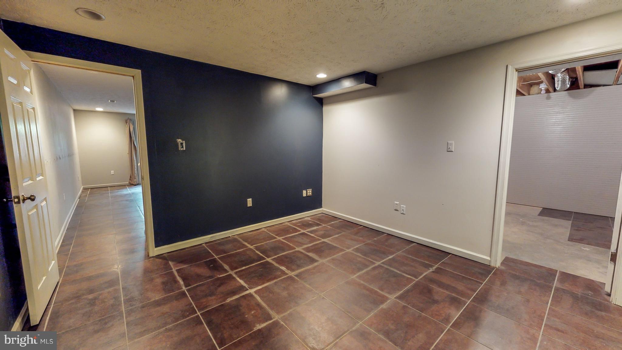 141 Holiday Road Cross Junction, VA 22625 - Photo 26 of 30 a view of a livingroom and an empty room