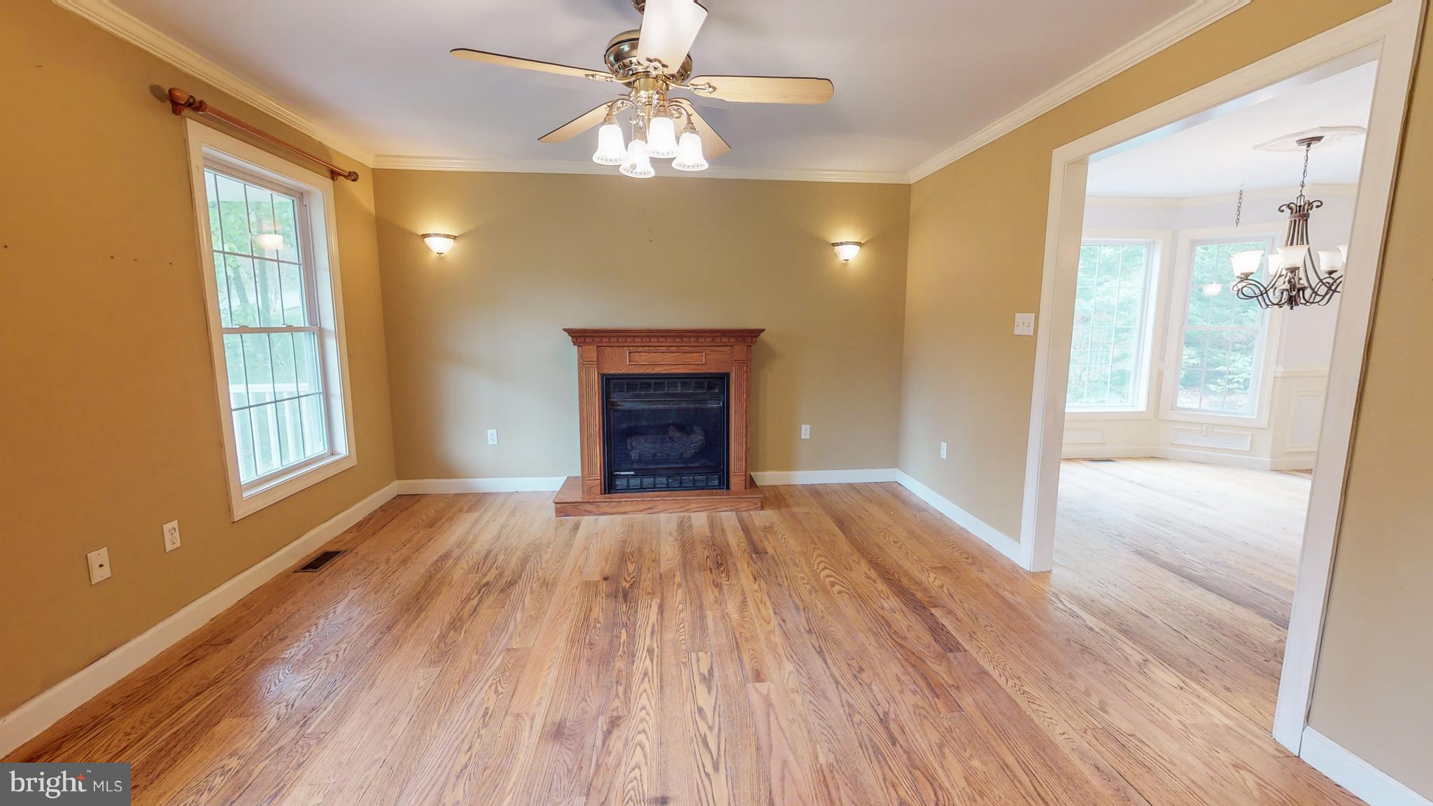 141 Holiday Road Cross Junction, VA 22625 - Photo 5 of 30 a view of empty room with wooden floor and fan