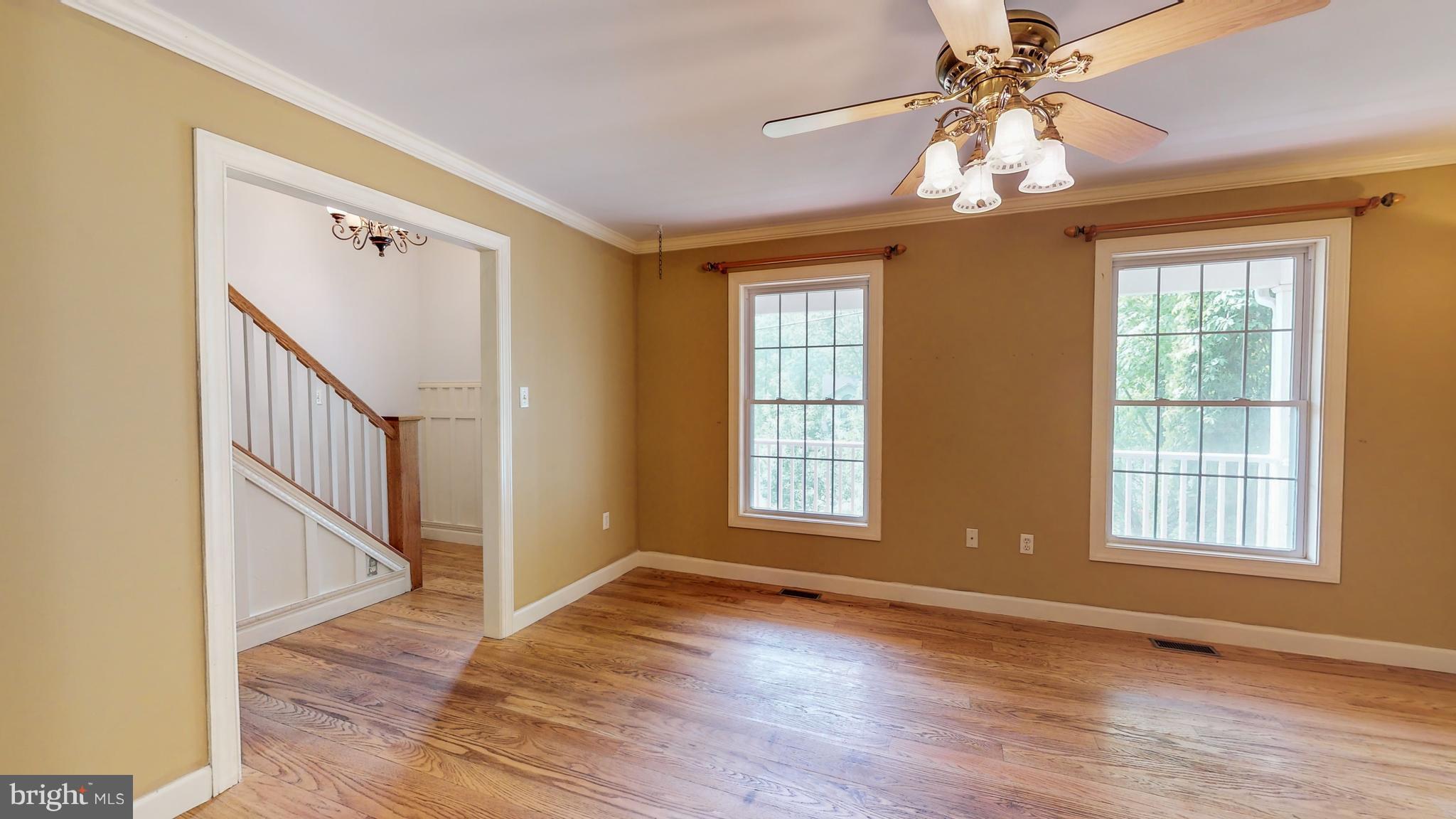 141 Holiday Road Cross Junction, VA 22625 - Photo 7 of 30 a view of an empty room with wooden floor and a window