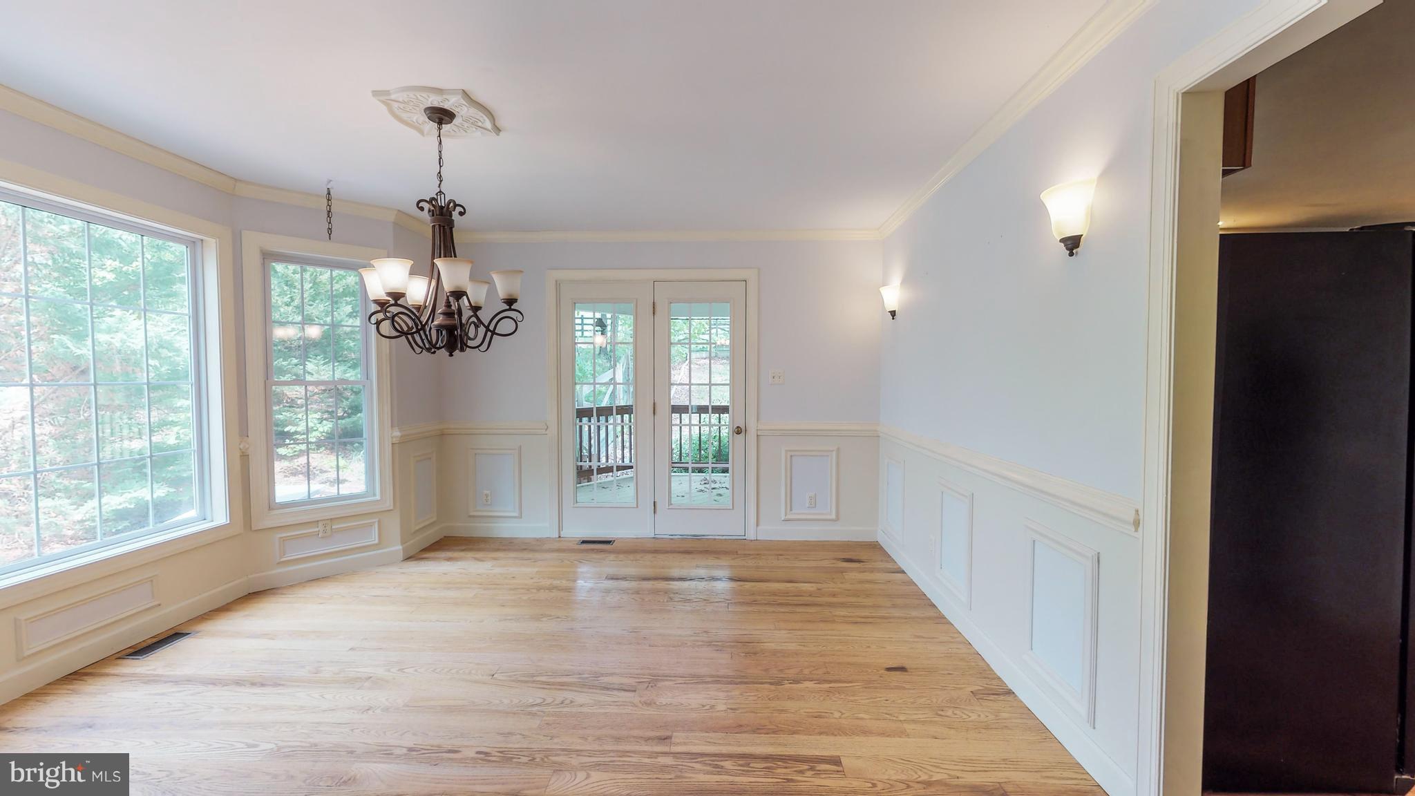 141 Holiday Road Cross Junction, VA 22625 - Photo 8 of 30 a view of a room with wooden floor chandeliers and kitchen