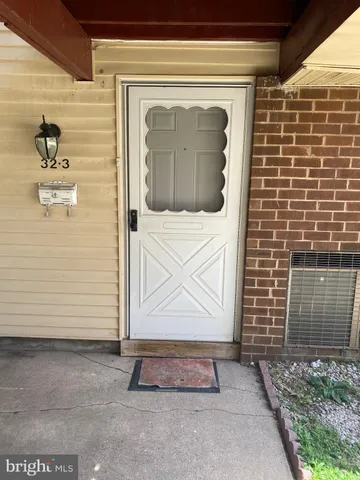 a front view of a house with a gate
