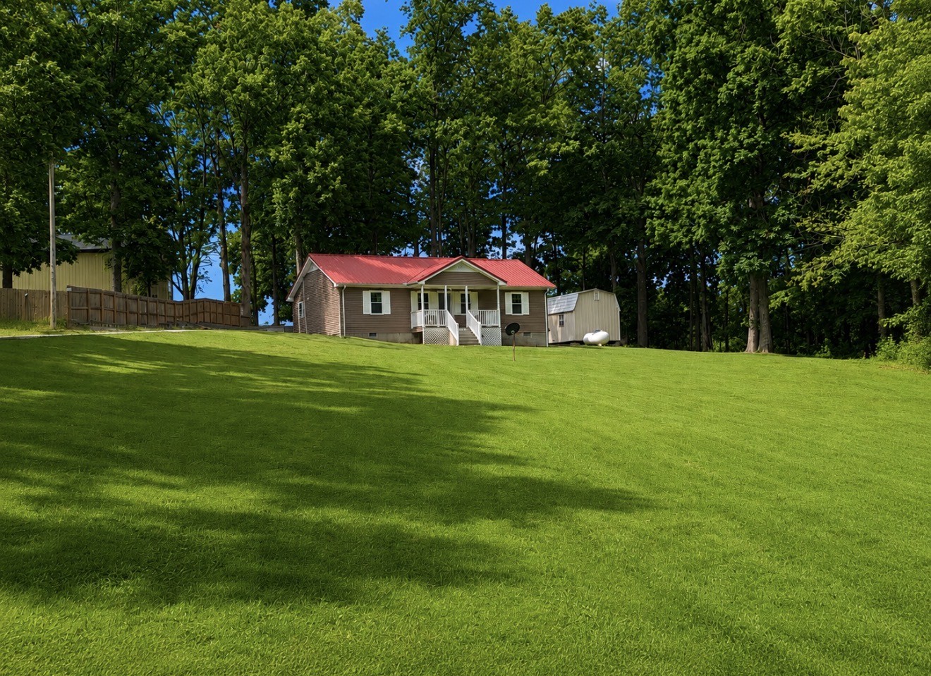 153 Henry Harris Road Westmoreland, TN 37186 - Photo 1 of 18 a house with garden in front of it