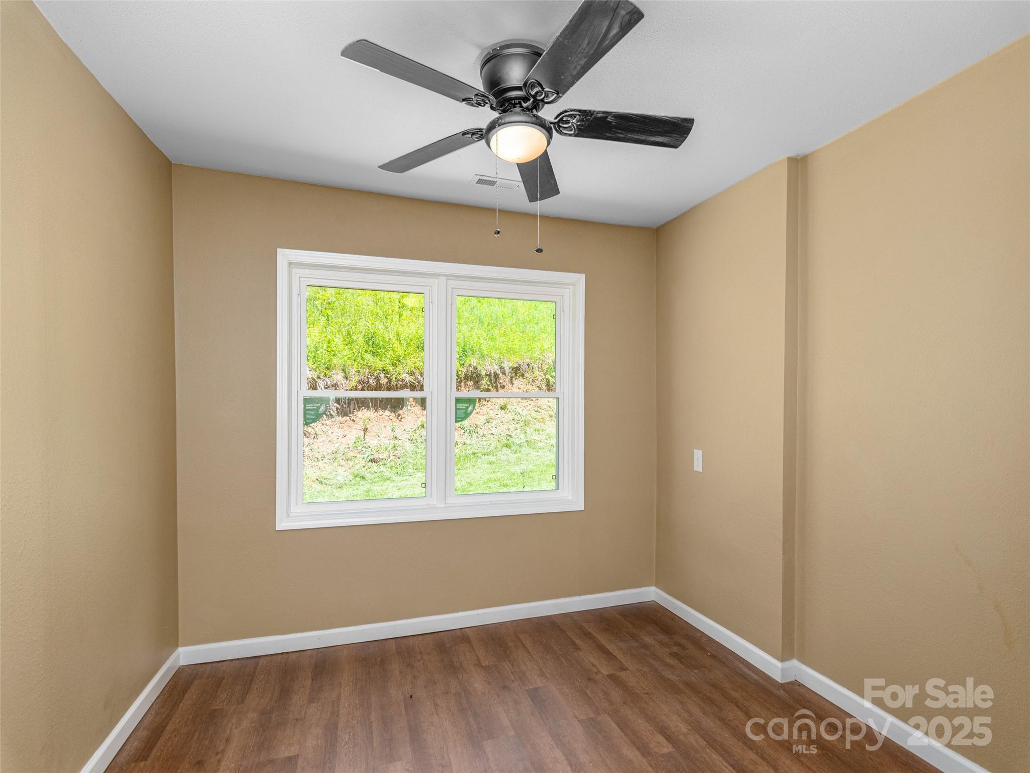 280 Noland Drive Clyde, NC 28721 - Photo 20 of 32 a view of an empty room with a window