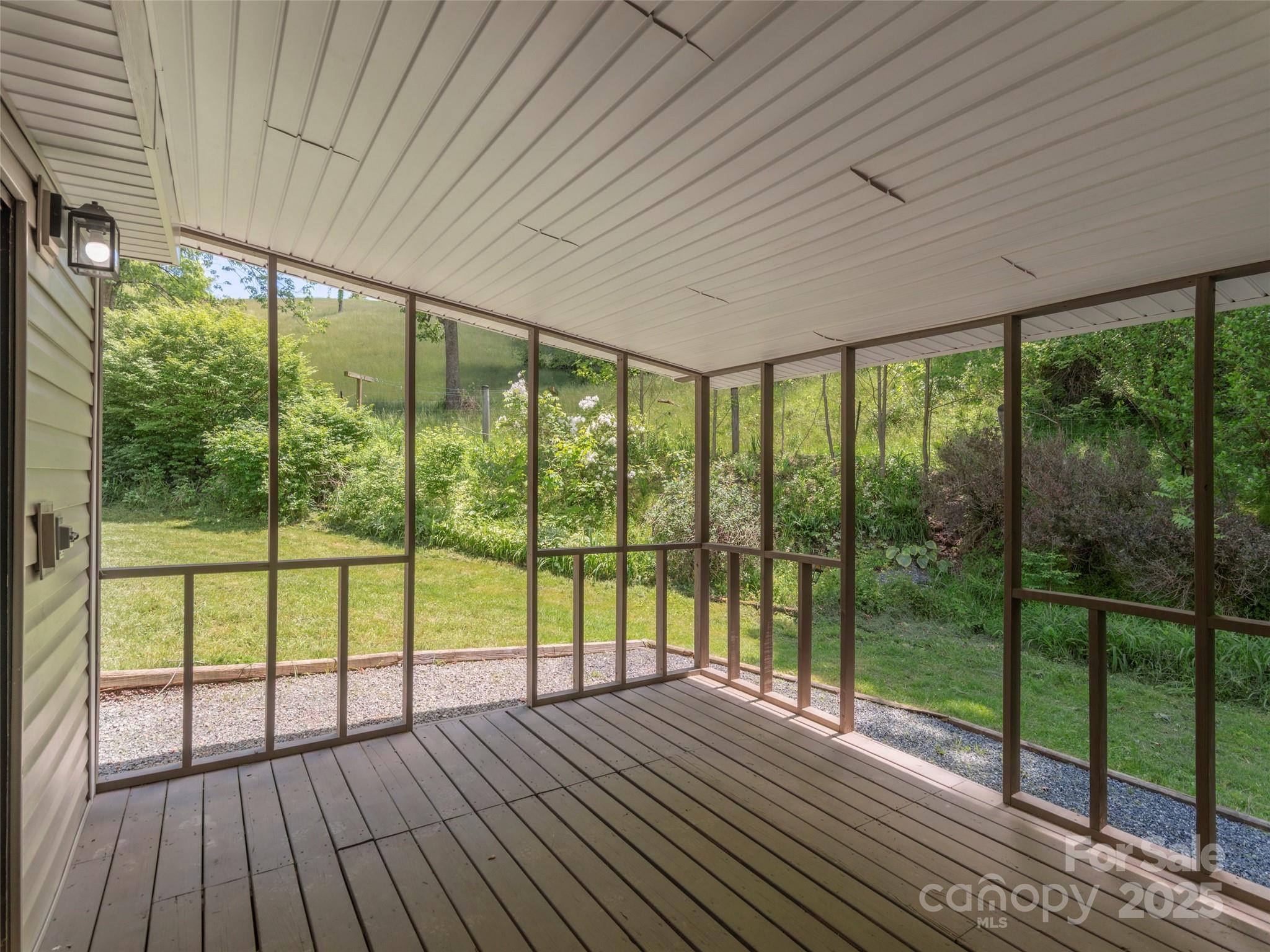 280 Noland Drive Clyde, NC 28721 - Photo 21 of 32 a view of empty room with wooden floor