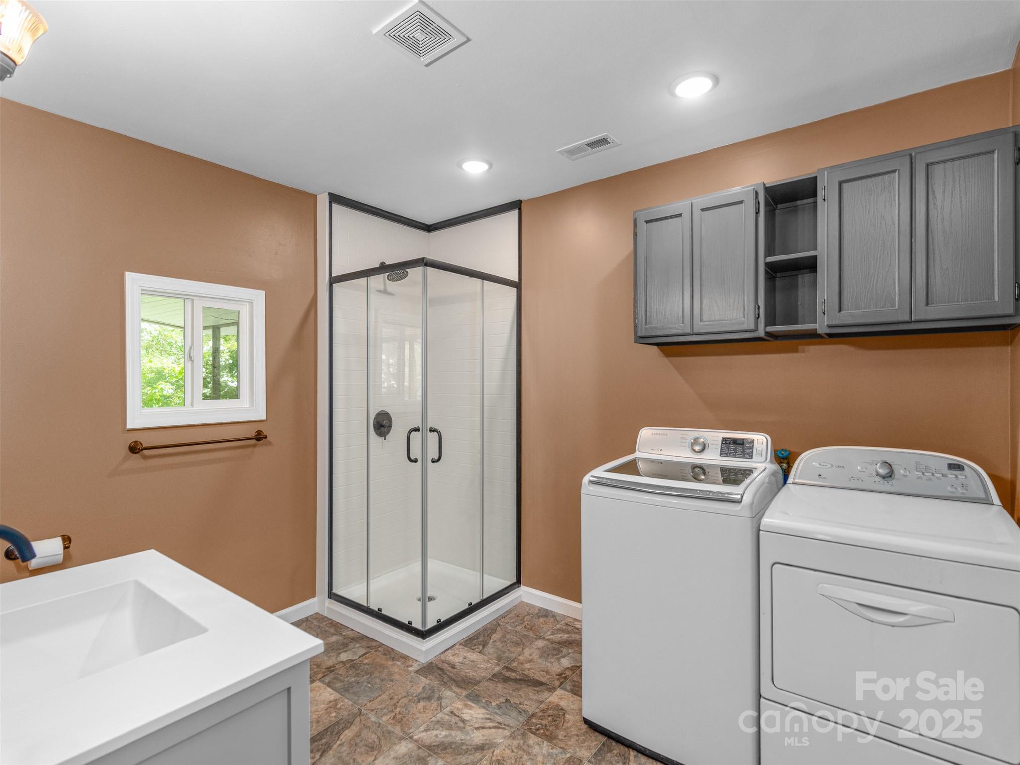 280 Noland Drive Clyde, NC 28721 - Photo 23 of 32 a bathroom with a sink toilet and vanity