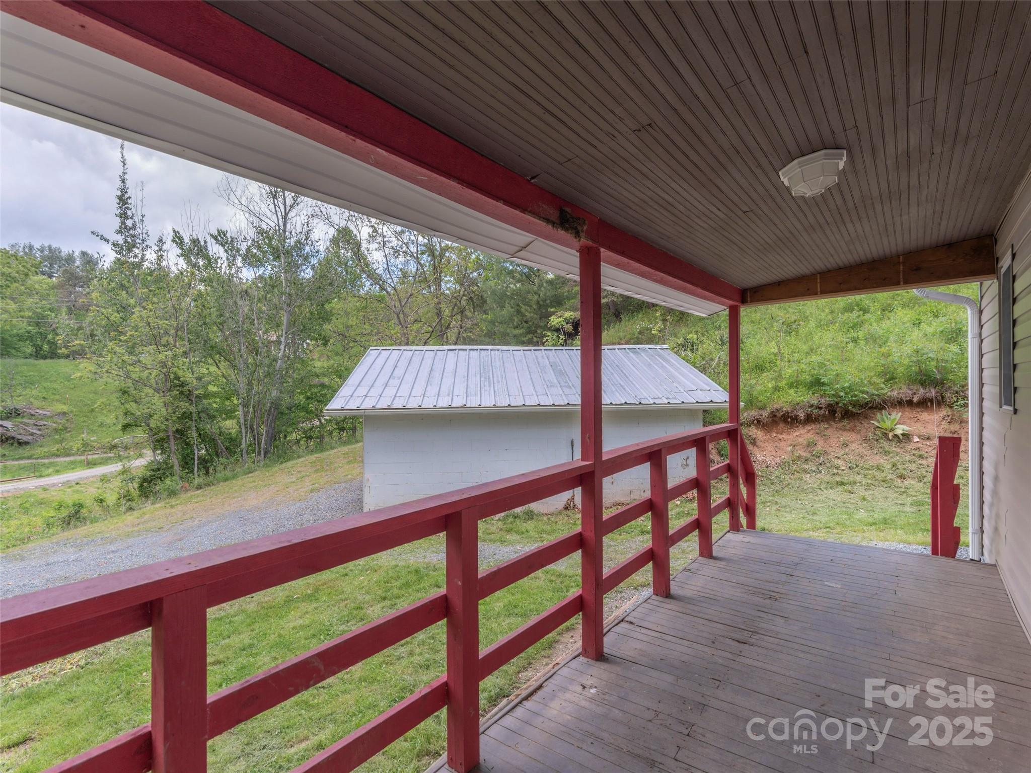 280 Noland Drive Clyde, NC 28721 - Photo 29 of 32 a view of a patio with a table chairs and a table