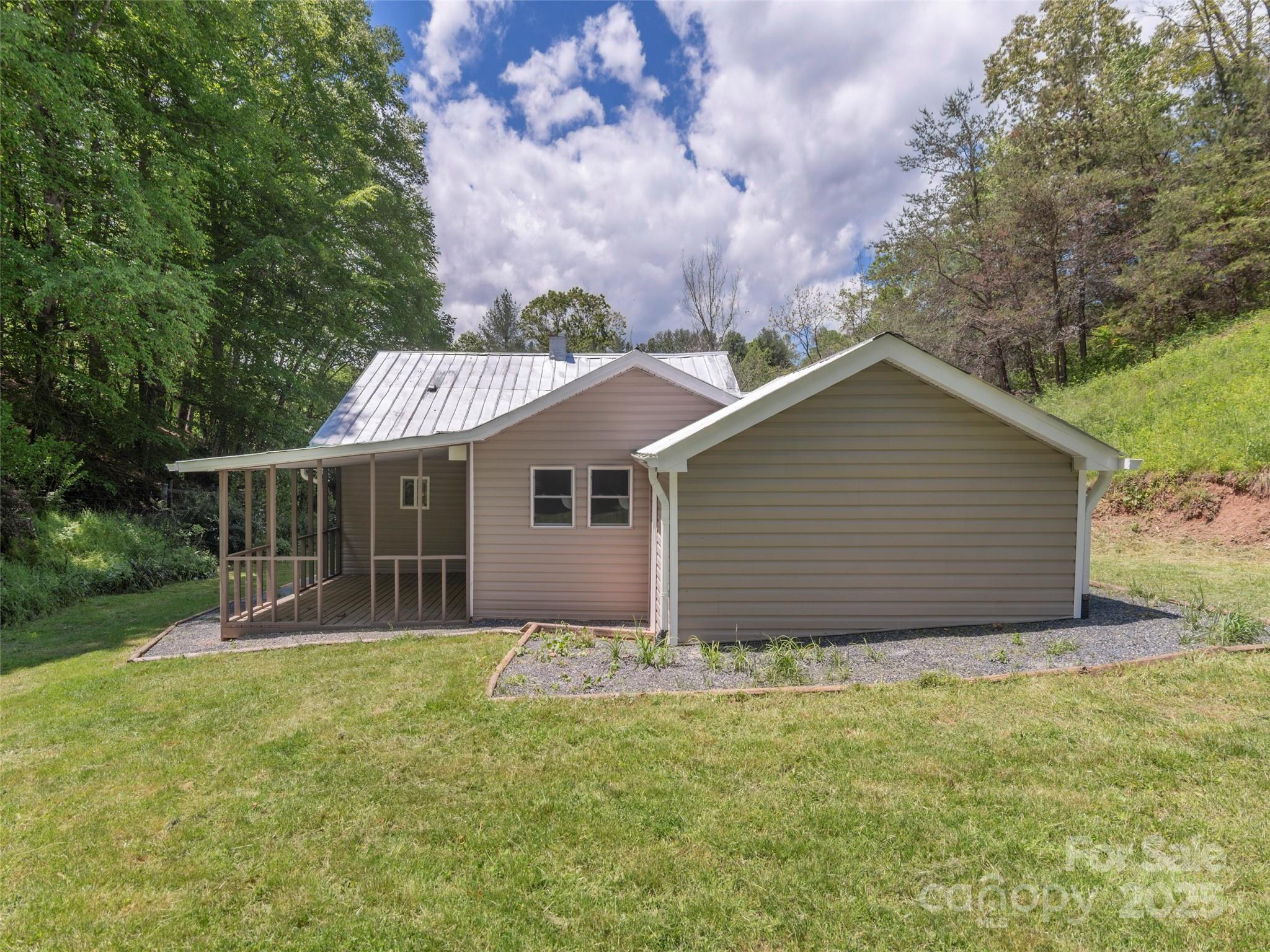 280 Noland Drive Clyde, NC 28721 - Photo 3 of 32 a front view of house with yard and green space