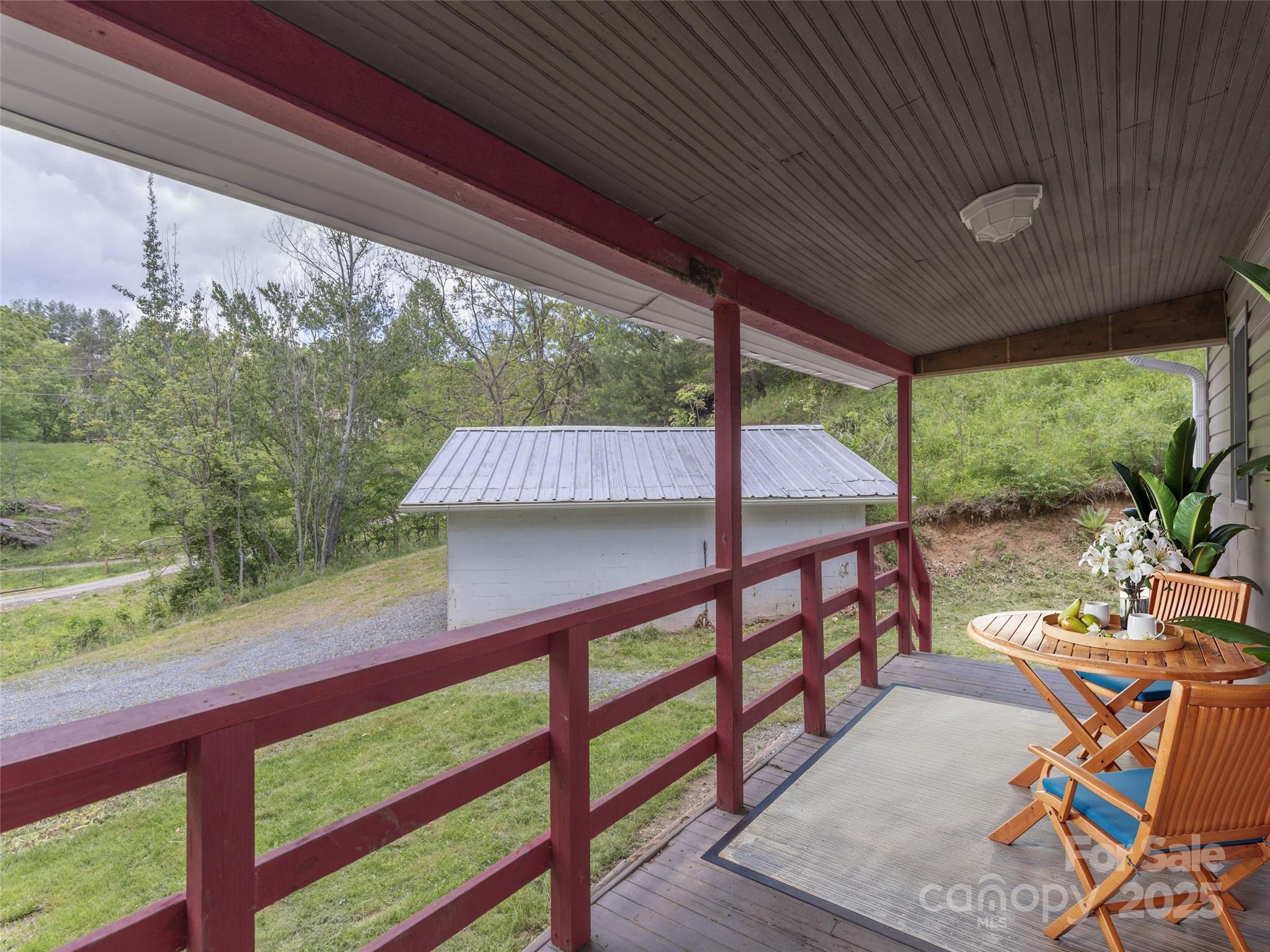 280 Noland Drive Clyde, NC 28721 - Photo 6 of 32 a view of a patio with wooden floor