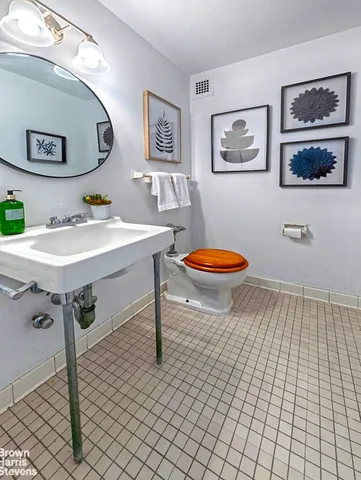 a bathroom with a sink a toilet and bathtub
