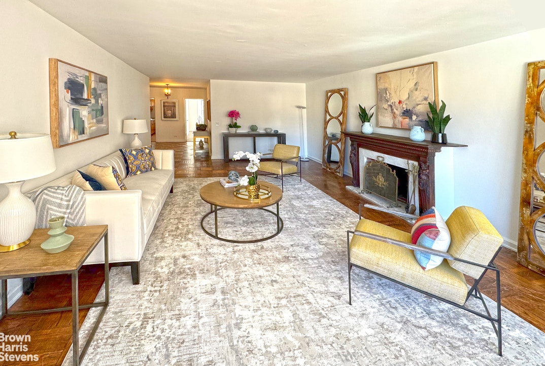35 Sutton Place, Unit 14F Manhattan, NY 10022 - Photo 2 of 15 a living room with furniture and a fireplace