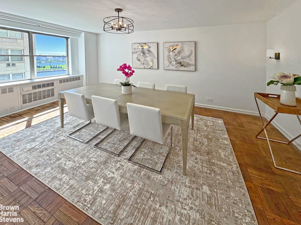 35 Sutton Place, Unit 14F Manhattan, NY 10022 - Photo 5 of 15 a living room with a couch and a table