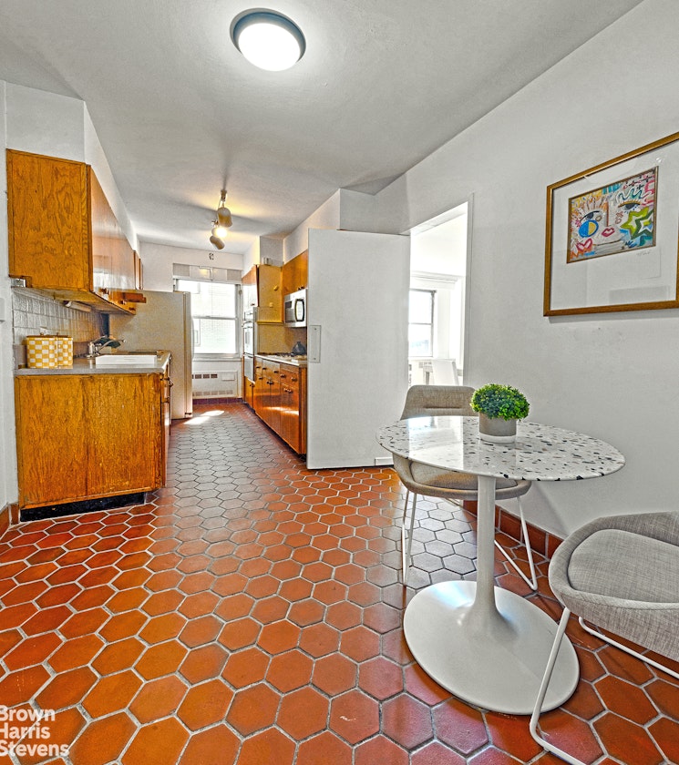 35 Sutton Place, Unit 14F Manhattan, NY 10022 - Photo 6 of 15 a dining room with furniture and wooden floor