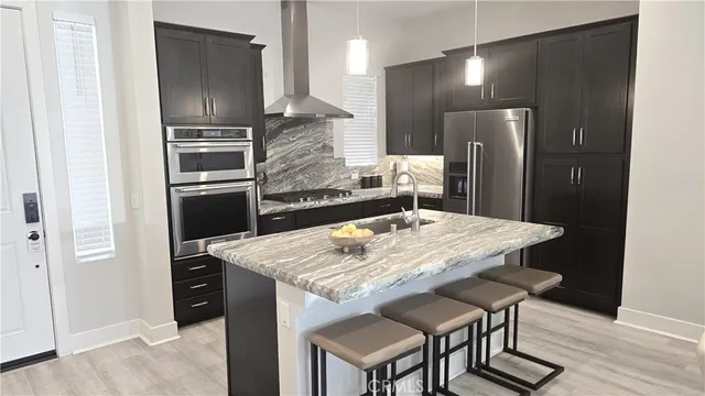 a kitchen with a table and chairs