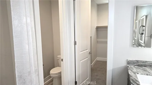 a view of a bathroom from a hallway