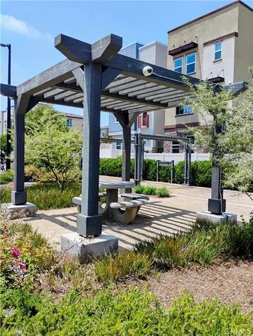 a view of a house with a porch and garden