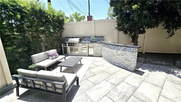 a view of backyard with seating space