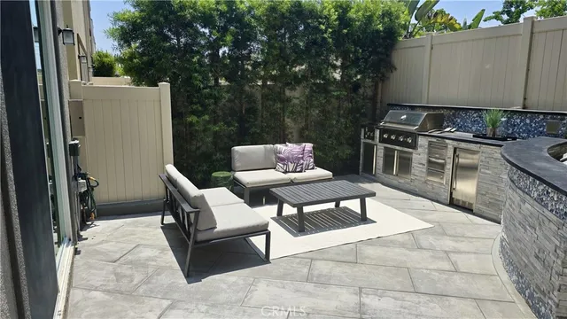 a backyard of a house with table and chairs