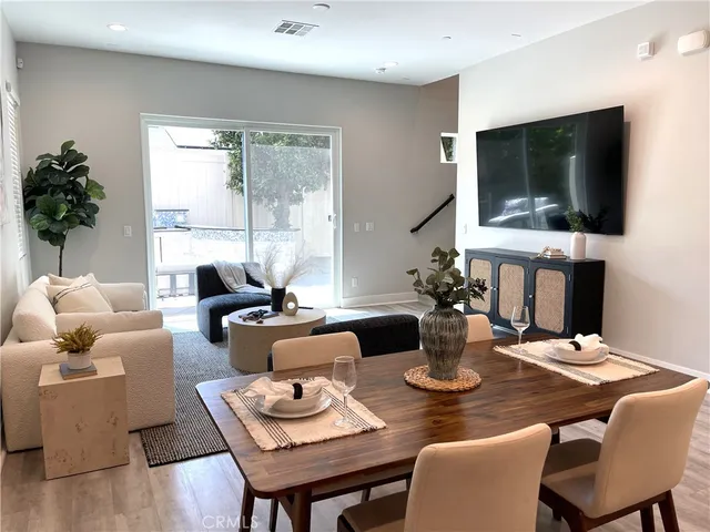 a living room with fireplace furniture and a flat screen tv
