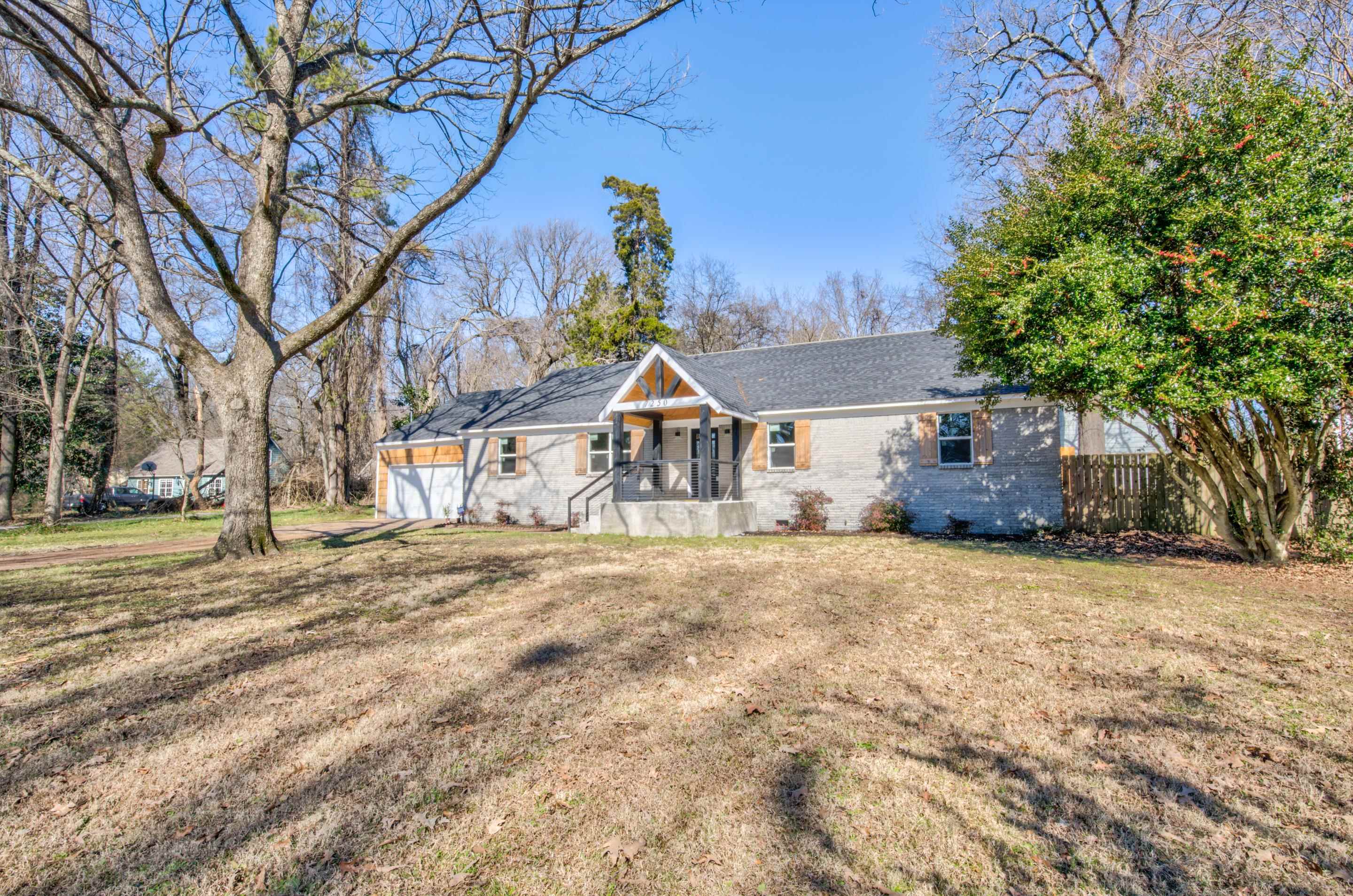 a house with trees in front of it