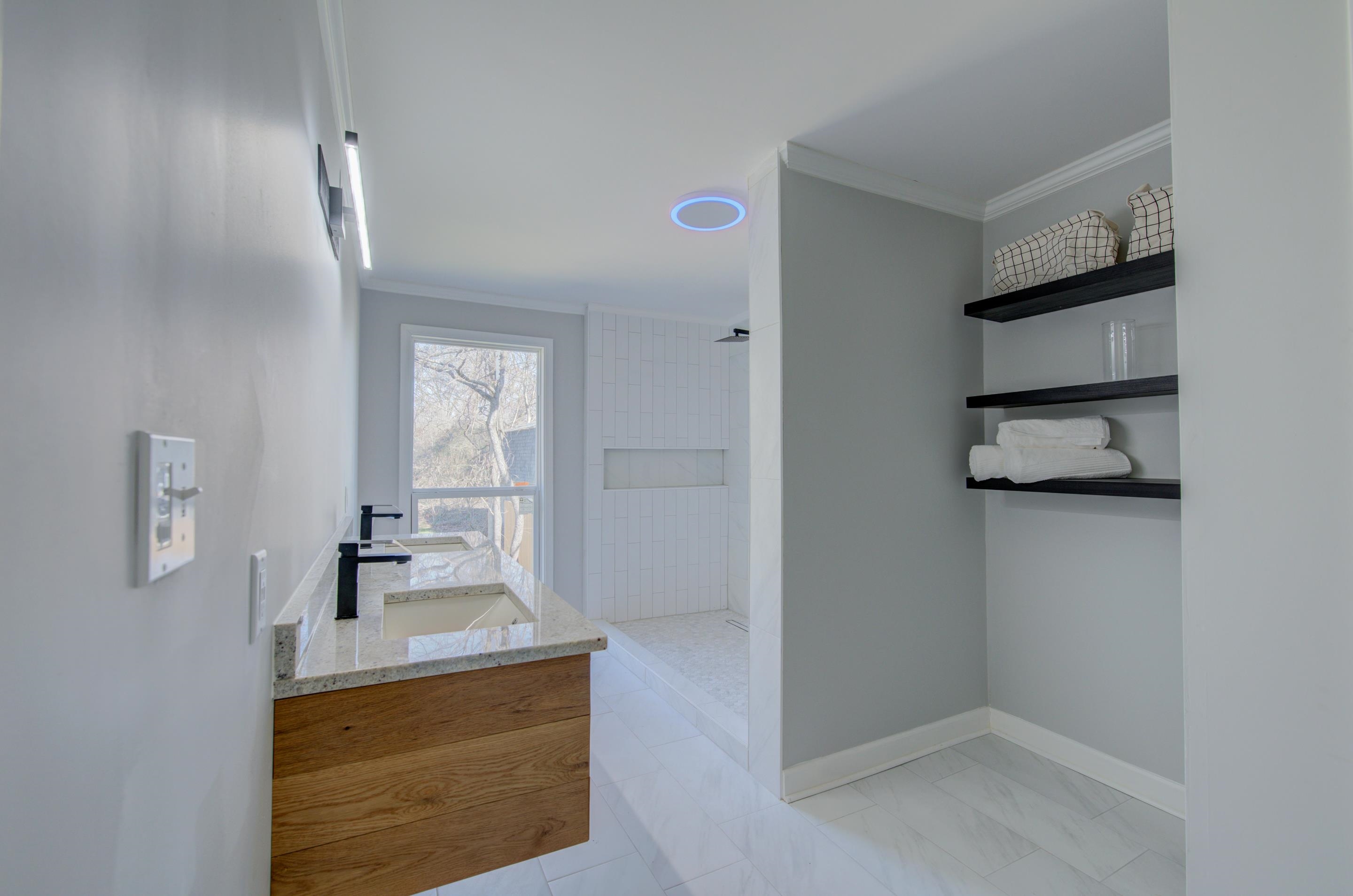 7250 Cedar Road Bartlett, TN 38135 - Photo 13 of 25 a bathroom with a sink a mirror and shower