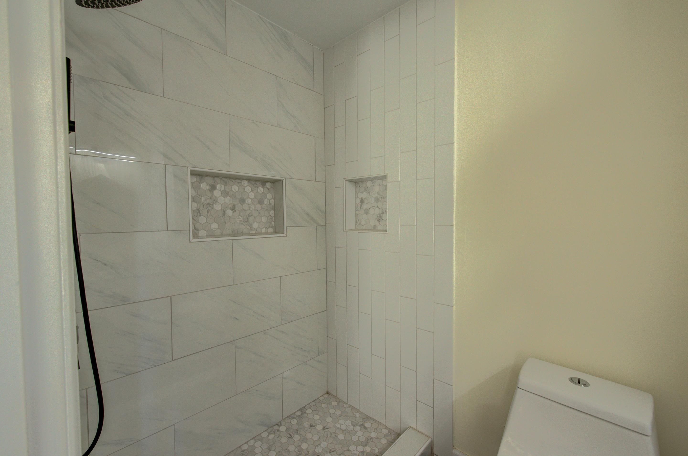 7250 Cedar Road Bartlett, TN 38135 - Photo 17 of 25 a bathroom with a granite countertop shower and a toilet