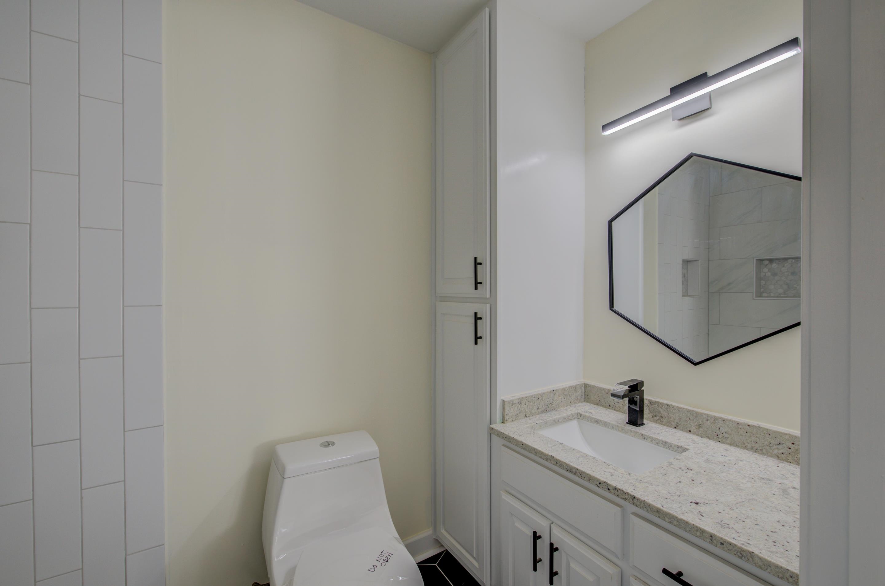 7250 Cedar Road Bartlett, TN 38135 - Photo 18 of 25 a bathroom with a granite countertop sink and a mirror