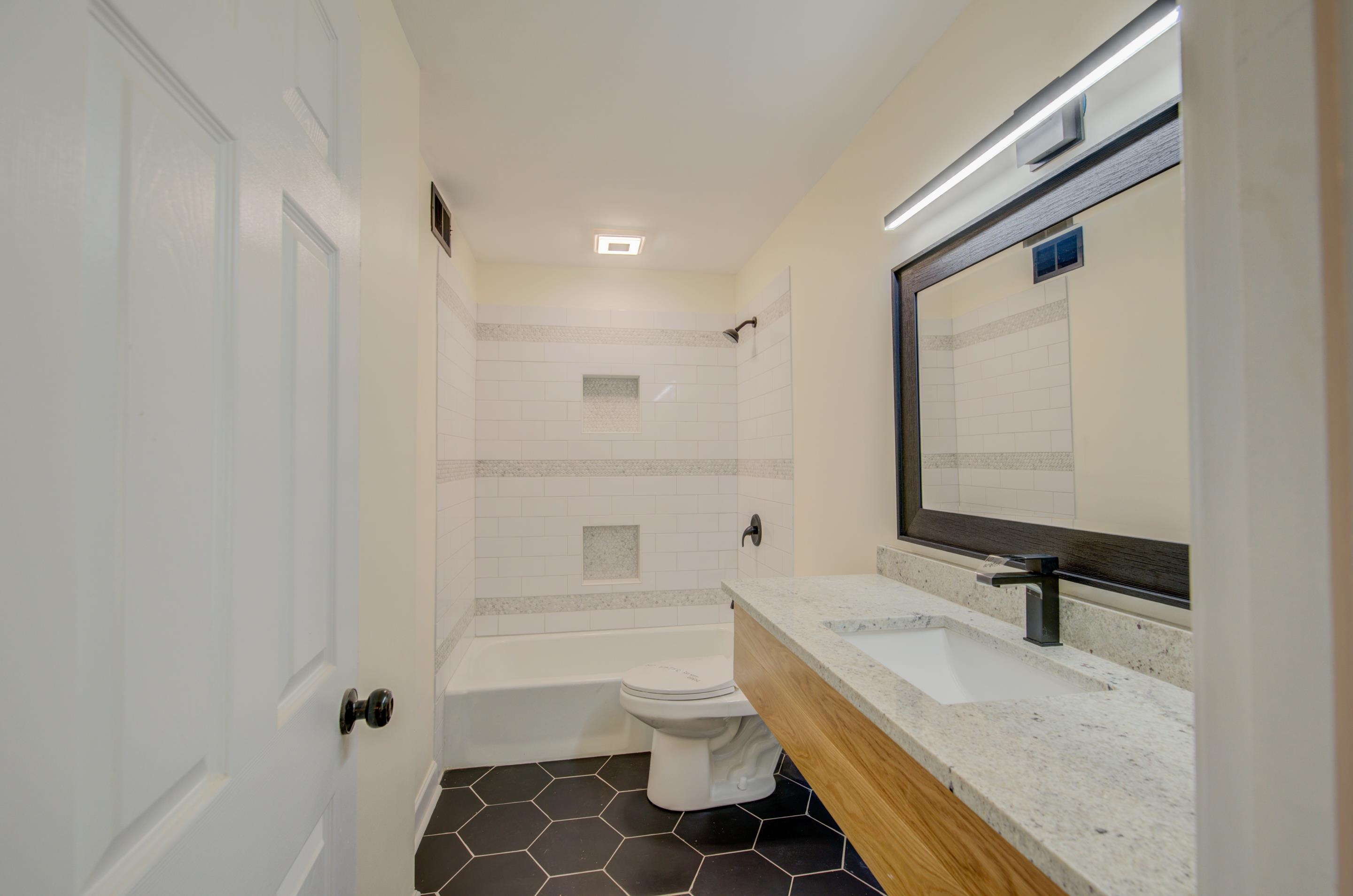 7250 Cedar Road Bartlett, TN 38135 - Photo 21 of 25 a bathroom with a granite countertop sink toilet and shower