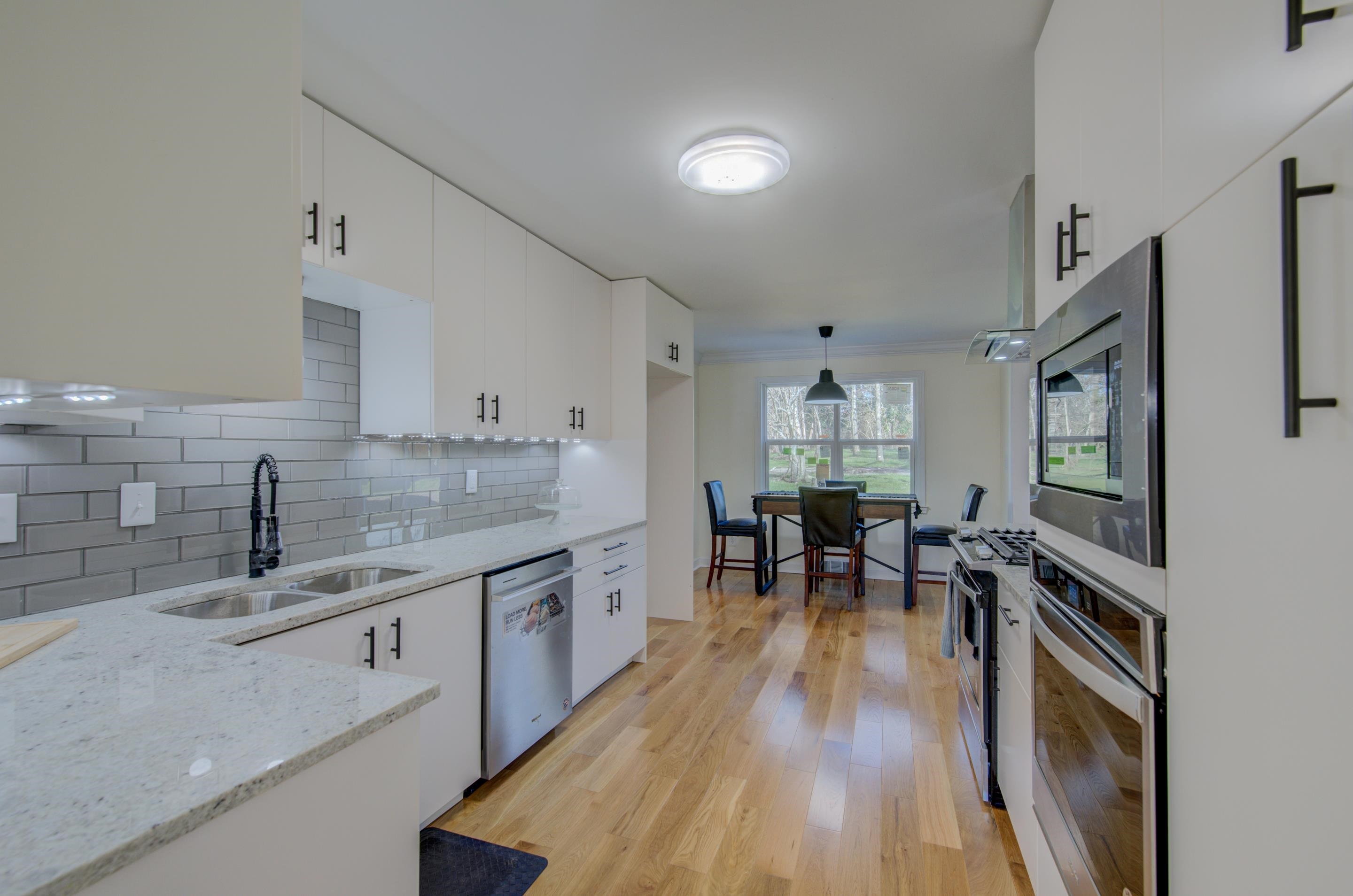 7250 Cedar Road Bartlett, TN 38135 - Photo 4 of 25 a kitchen with granite countertop a sink stove and cabinets