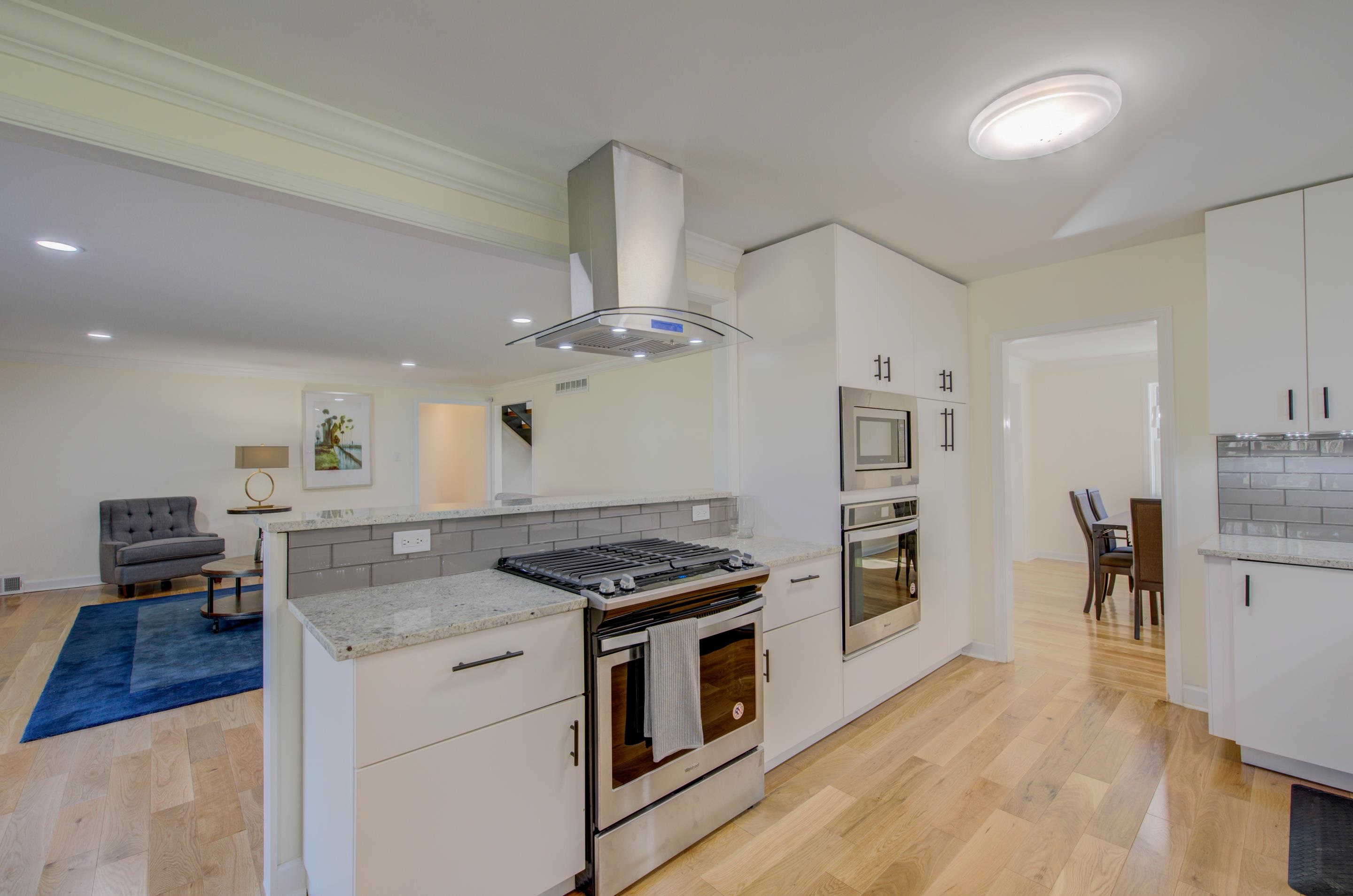 7250 Cedar Road Bartlett, TN 38135 - Photo 9 of 25 a kitchen with granite countertop a stove and a refrigerator