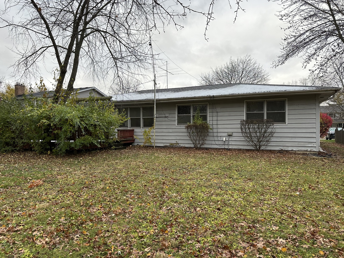 104 Devon Lane Naperville, IL 60540 - Photo 2 of 3 a front view of a house with a garden