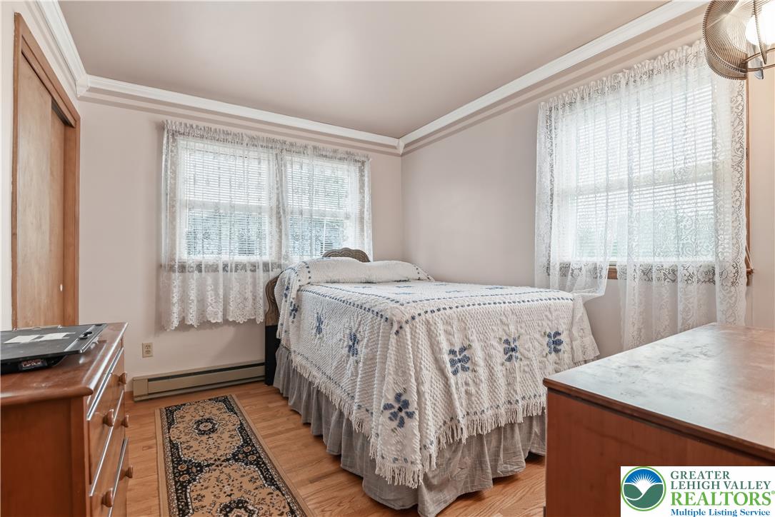 3303 Barklay Road Whitehall, PA 18052 - Photo 22 of 39 Bright hardwood floors and abundant natural light create a welcoming and serene sleeping space.