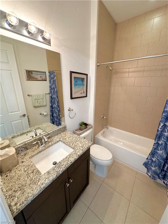 2956 Willow Ridge Court Fort Myers, FL 33905 - Photo 9 of 24 a bathroom with a granite countertop sink toilet and shower