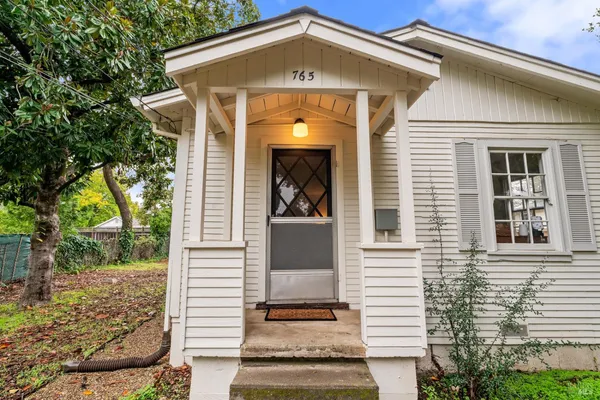 a front view of a house with a porch