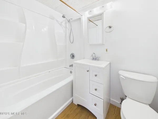 a bathroom with a sink a toilet and a bathtub